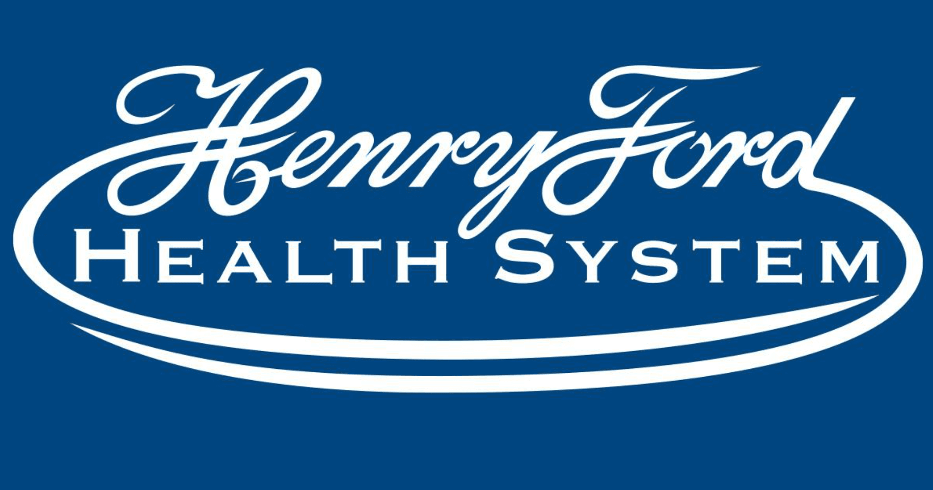 Henry Ford Health System logo featuring white cursive and serif text on blue background.